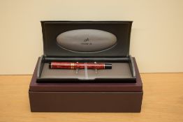 A boxed Modern Parker Duofold International converter fill fountain pen in Jasper Red with two cap