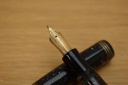 A Parker Vacumatic oversized fountain pen in grey pearl with three gold cap bands having Parker