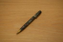 A Parker Premiere propelling pencil in grey marble with red specks.