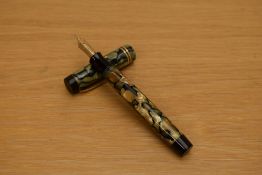 A Parker Duofold senior button fill fountain pen in pearl and black lined pattern with three