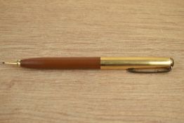 A Parker 51 propelling pencil in tan with rolled gold cap