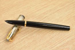 A Parker 51 converter fill fountain pen in black with empire state cap with gold blue diamond clip.
