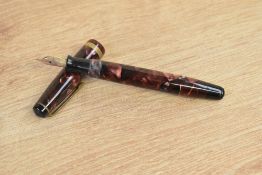 A Parker Challenger button fill fountain pen in black and red marble with one broad gold cap band