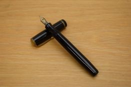 A Parker Premiere button fill fountain pen in black with single gold cap band having Parker 14k