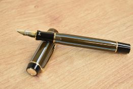 A boxed Parker Duofold Centennial converter fill fountain pen in chocolate pinstripe having