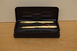 A boxed Parker Sonnet Premiere Cascade converter fill fountain pen roller ball set in gold having