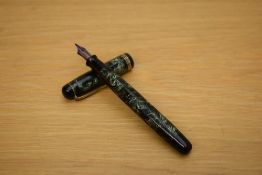 A Parker Televisor Standard button fill fountain pen in lined green with three gold cap bands having