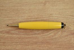A Parker Duofold torpedo vest pocket propelling pencil in Mandarin Yellow with ring top