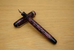 A Parker Televisor Standard button fill fountain pen in rose lined pattern with three narrow gold
