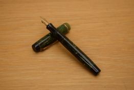 A Parker Duofold Lady button fill fountain pen in jade green with three gold bands to the cap having