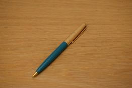 A Parker 61 propelling pencil in turquoise with rolled gold cap