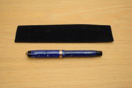 A Parker Duofold Lady button fill fountain pen in lapis lazulii with three gold bands to the ring