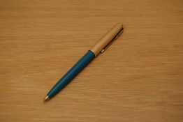 A Parker 61 ballpoint pen in turquoise with rolled gold cap