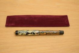 A Parker Duofold Lady Deluxe button fill fountain pen in black and pearl with three gold bands to