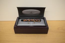 A boxed Parker Duofold Centennial converter fill fountain pen in check amber with gold trim having