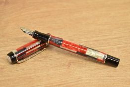 A boxed Parker Duofold International converter fill fountain pen in red mosaic with chrome trim