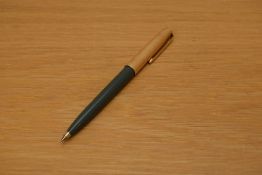 A Parker 51 ballpoint pen in grey with rolled gold cap.