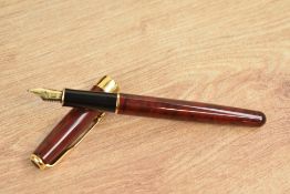 A boxed Parker Sonnet converter fill fountain pen in Chinese red laque with gold trim having