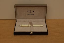 A boxed Parker Duofold International converter fill fountain pen in Ivorine white with gold trim