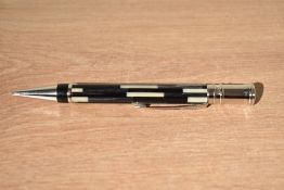 A boxed Parker Duofold propelling pencil in black mosaic with chrome trim. With booklet