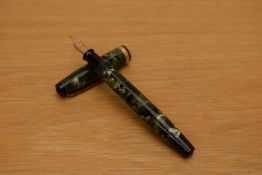 A Parker Challenger button fill fountain pen in green and black marble with broad gold cap band