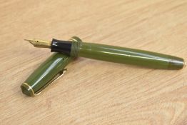 A Parker Duofold Victory button fill fountain pen in olive green with two gold cap bands having