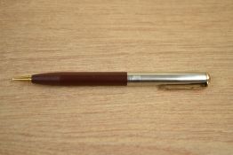A Parker 51 propelling pencil in Cordovan Brown with lustraloy cap with jewellers band and gold fill