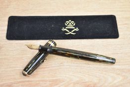 A Parker Duofold Streamline button fill fountain pen in green and brown striated pattern with single