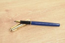 A Parker 75 Insignia converter fill fountain pen in in blue with custom gold plated cap having