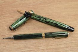 A Parker Duofold Standard button fill fountain pen and propelling pencil in green and black