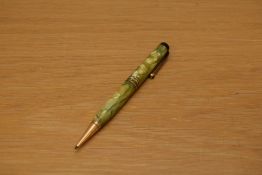 A Parker Duofold pencil in green and pearl with three gold bands to the cap