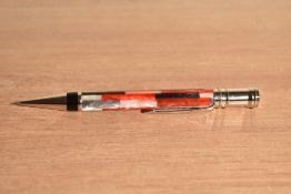 A boxed Parker Duofold propelling pencil in red mosaic with chrome trim. With booklet