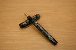 A Parker Duofold Junior button fill fountain pen in grey and black hatched pattern with a single