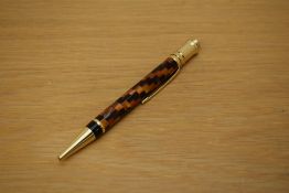 A Parker Duofold ballpoint pen in amber check