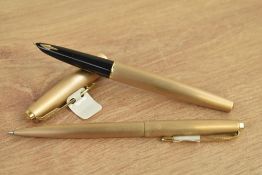 A Parker 61 Cirrus converter fill fountain pen and ballpoint pen in rolled gold. Come with