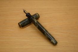 A Parker Premiere button fill fountain pen in grey marble with red specks with single gold cap
