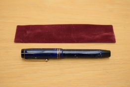 A Parker Duofold Senior button fill fountain pen in lapis lazulii with two gold bands to the cap