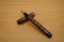 A Parker Victory button fill fountain pen in rose and silver hatched pattern having a Parker