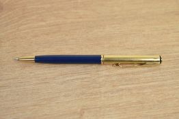 A Parker 75 Insignia ballpoint pen in in blue with custom gold plated cap