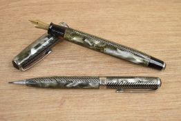 A boxed Parker Royal Challenger button fill fountain pen and propelling pencil set in grey and black