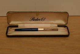 A boxed Parker 61 converter fill fountain pen in Teal blue with rolled gold cap