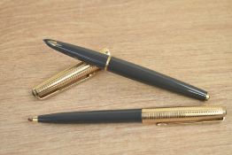 A boxed Parker 61 Consort capillary fill fountain pen and ballpoint pen in grey with rolled gold