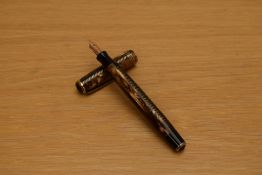 A Parker Royal Challenger Standard button fill fountain pen in brown and honey striated marble