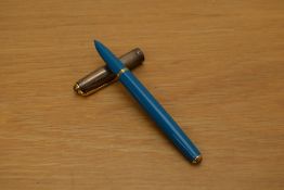 A Parker 51 MKII converter fill fountain pen in Turquoise with empire cap with double diamond.