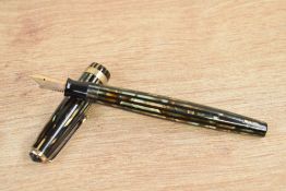 A Parker Duofold Streamline button fill fountain pen in green and brown striated pattern with single