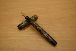 A Parker Duofold Special button fill fountain pen in brown and gold hatched pattern with a single