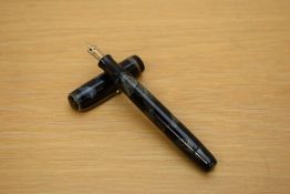 A Parker Premiere button fill fountain pen in blue black marble with single gold cap band having