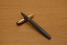 A Parker 51 Vacumatic fill fountain pen in grey with rolled gold cap. Some wear to cap
