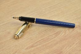 A Parker 75 Insignia rollerball pen in in blue with custon gold plated cap