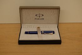 A boxed Parker Duofold Centennial converter fill fountain pen in Lapis lazulii with gold trim having